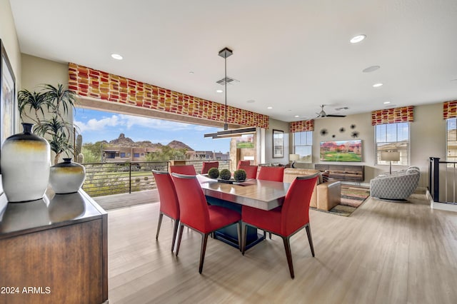 dining area featuring ceiling fan and light hardwood / wood-style flooring