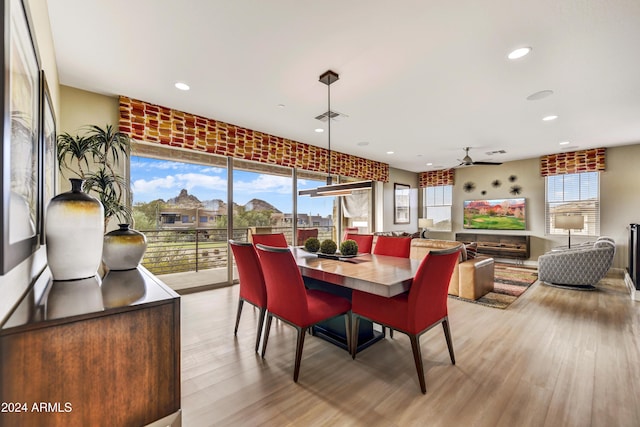 dining room featuring ceiling fan and light hardwood / wood-style floors