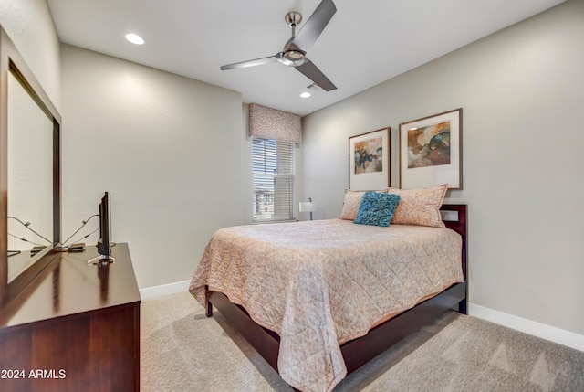 bedroom with ceiling fan and light colored carpet