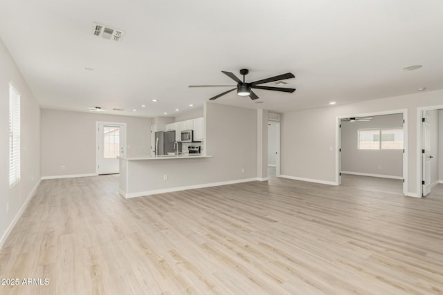 unfurnished living room with ceiling fan, recessed lighting, light wood-style flooring, and visible vents
