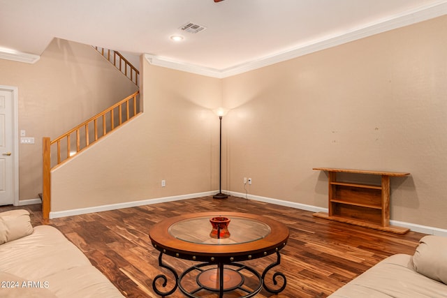 living room featuring dark hardwood / wood-style floors and ornamental molding