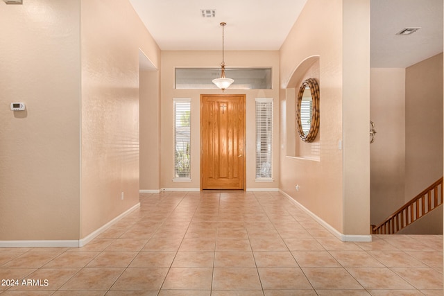 foyer entrance featuring light tile patterned floors