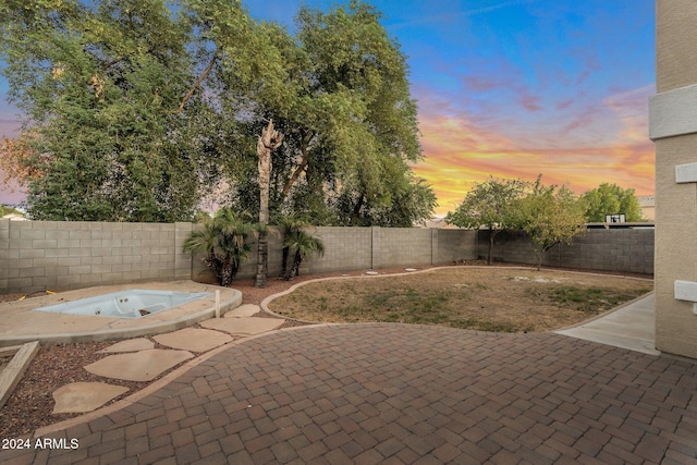 view of patio terrace at dusk