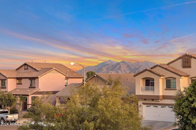 mediterranean / spanish-style home featuring a garage and a mountain view