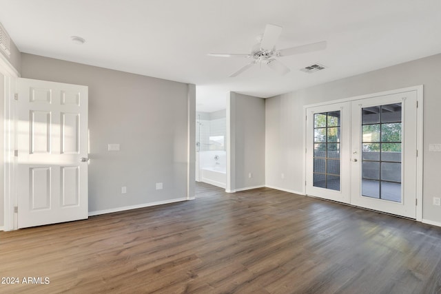 spare room with french doors, ceiling fan, and dark hardwood / wood-style flooring