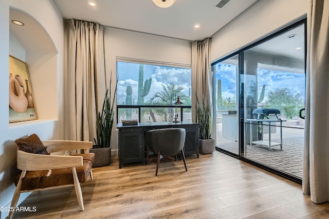 sitting room featuring wood finished floors and recessed lighting