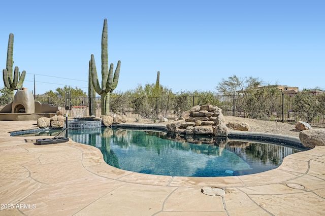 view of swimming pool with fence, a fenced in pool, and a patio