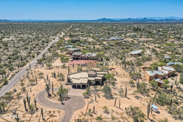 drone / aerial view with a rural view, a desert view, and a mountain view
