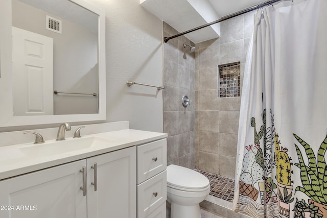 bathroom featuring vanity, a shower with curtain, and toilet