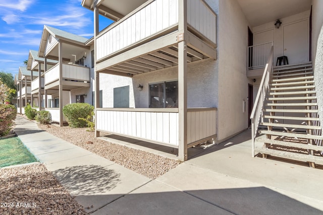 view of property exterior with a balcony