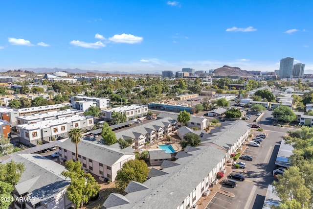 birds eye view of property with a mountain view