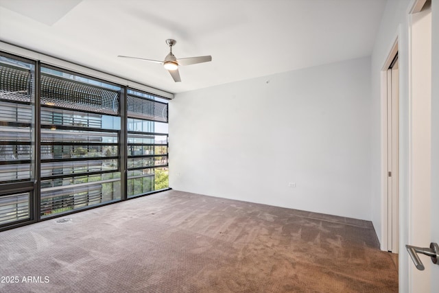 7180 E Kierland Blvd Unit 507, Scottsdale, AZ 85254 - carpeted empty room featuring expansive windows and ceiling fan