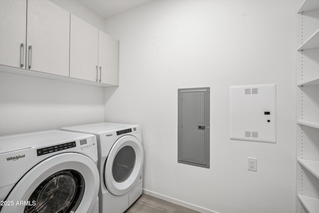 7180 E Kierland Blvd Unit 507, Scottsdale, AZ 85254 - laundry area featuring electric panel, separate washer and dryer, cabinet space, and light wood-style floors