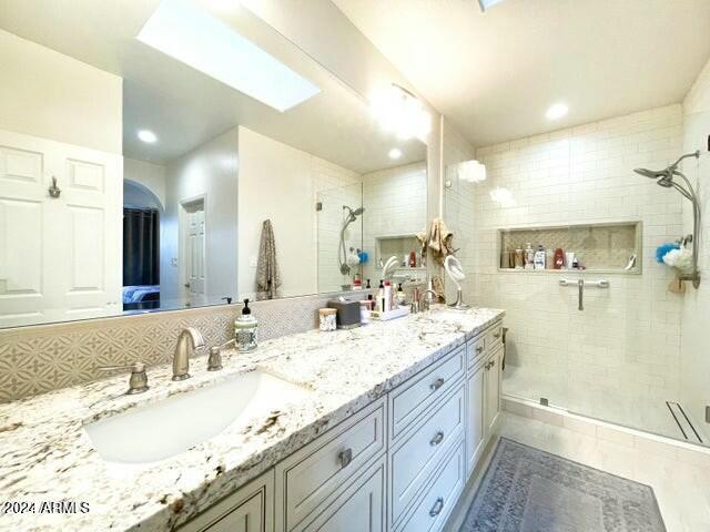 bathroom with vanity, tile patterned floors, and a shower with shower door