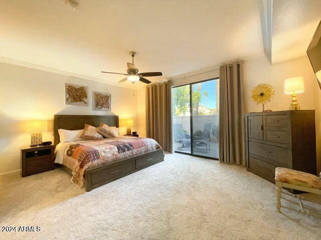 bedroom featuring access to exterior, ceiling fan, and light carpet