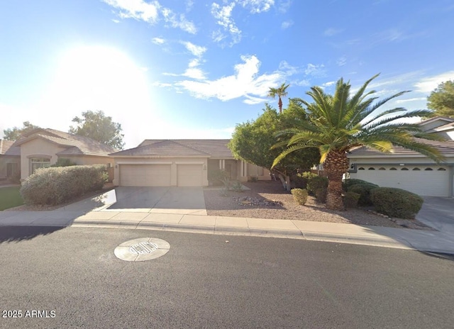 1038 S Palomino Creek Dr, Gilbert, AZ 85296 - view of front facade with concrete driveway, an attached garage, and stucco siding