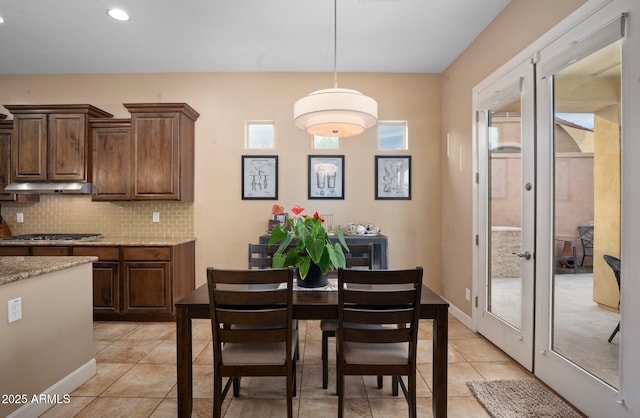 dining room with french doors, light tile patterned flooring, and recessed lighting