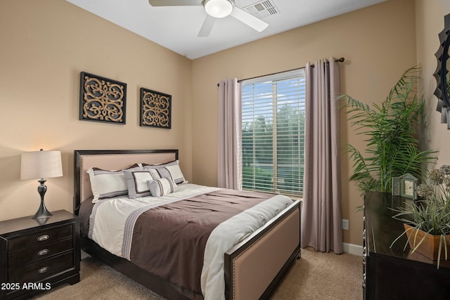 bedroom with light carpet and a ceiling fan
