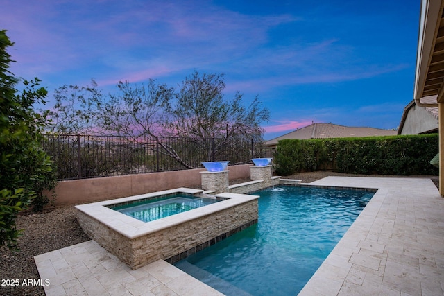 view of swimming pool featuring an in-ground hot tub, a fenced backyard, and a patio area