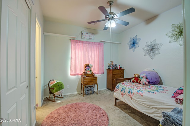 bedroom featuring a closet, baseboards, carpet, and ceiling fan