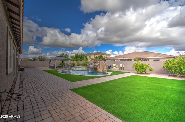 view of yard featuring a gazebo, a fenced in pool, a fenced backyard, and a patio area