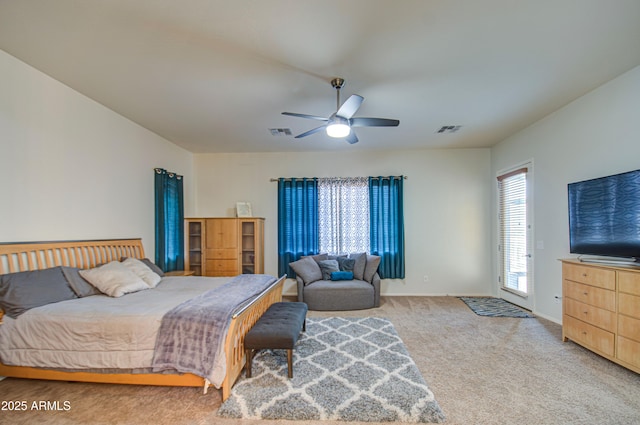 bedroom featuring ceiling fan, baseboards, visible vents, and light carpet