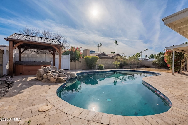 view of swimming pool featuring a gazebo, a hot tub, and a patio area