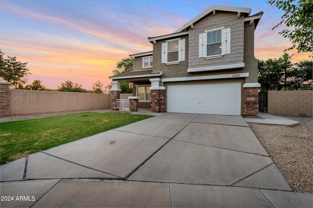 view of front of property with a lawn and a garage