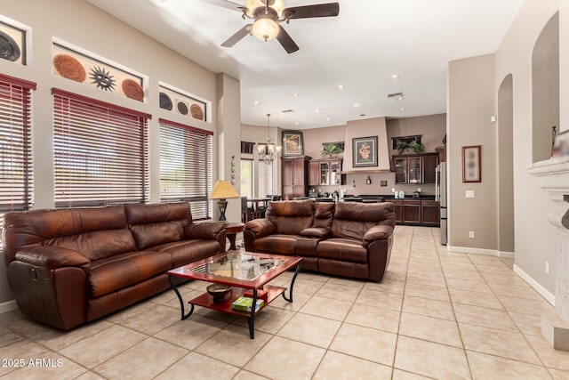 4041 N Silver Ridge Cir, Mesa, AZ 85207 - living room with light tile patterned floors, a ceiling fan, arched walkways, and recessed lighting