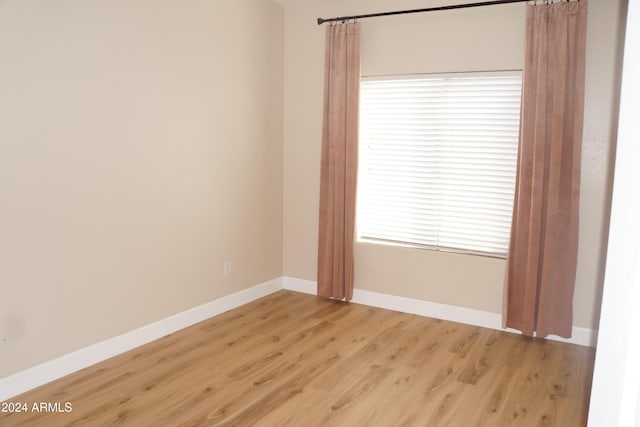 spare room featuring light wood-type flooring