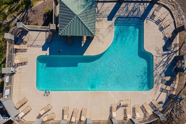 view of swimming pool featuring a patio area