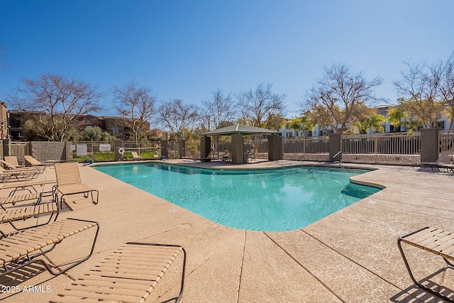 view of swimming pool with a gazebo and a patio area