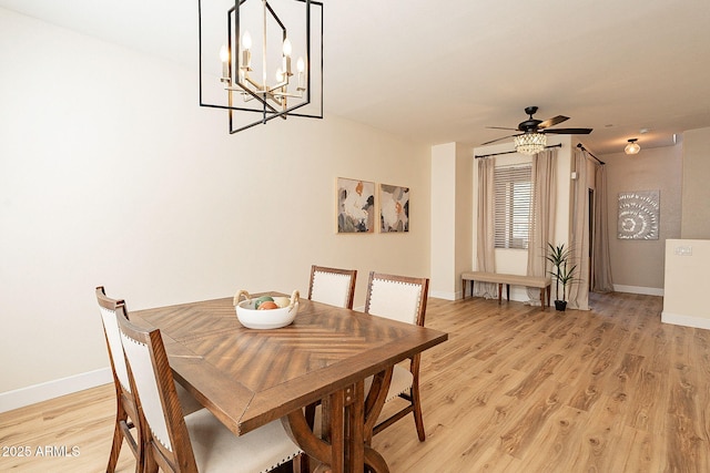 dining space featuring light hardwood / wood-style floors and ceiling fan