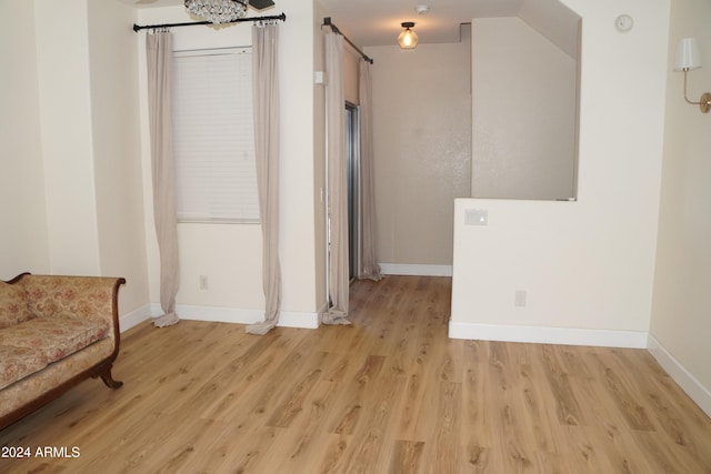 unfurnished room with light wood-type flooring