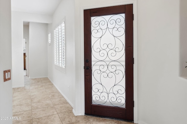 entrance foyer with a wealth of natural light and light tile patterned floors