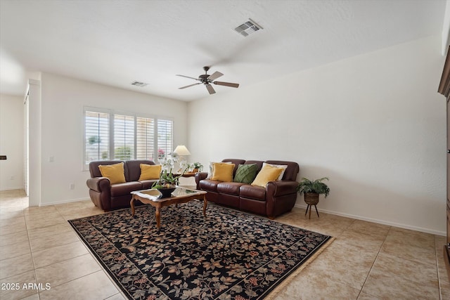 living room featuring ceiling fan and light tile patterned floors