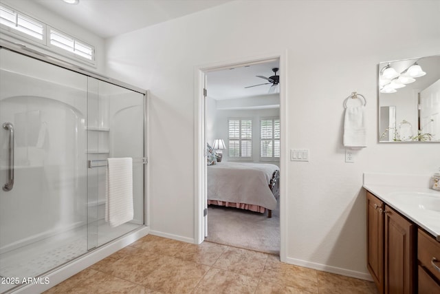 bathroom with tile patterned flooring, vanity, ceiling fan, and a shower with shower door