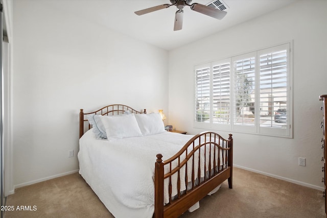 bedroom with light carpet and ceiling fan