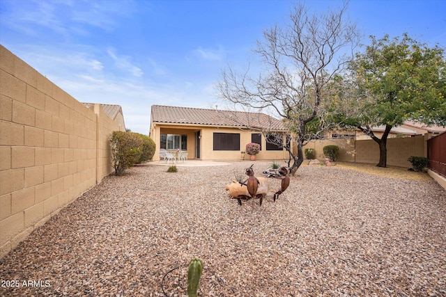 back of house featuring a patio