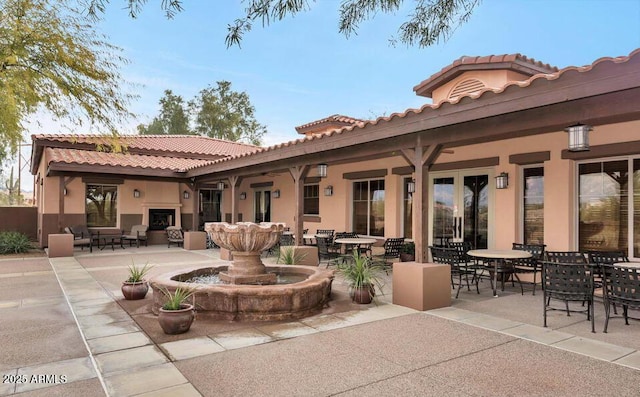 rear view of property featuring a patio