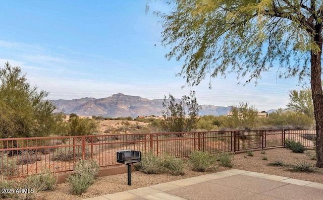 view of yard with a mountain view and a patio area