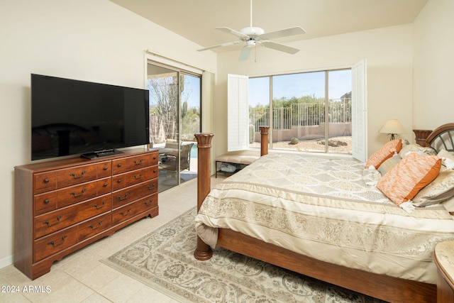 tiled bedroom with ceiling fan and access to exterior