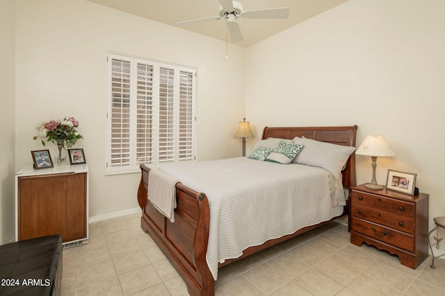 bedroom featuring ceiling fan and light tile floors