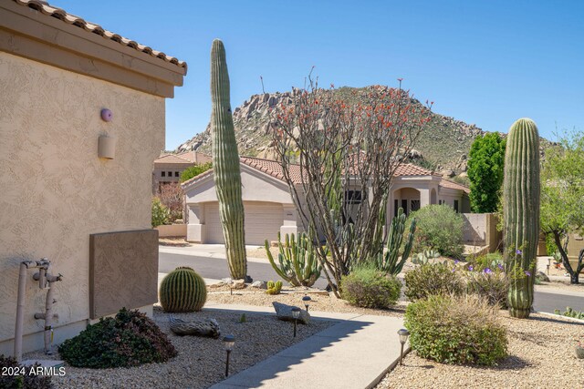 exterior space featuring a mountain view and a garage