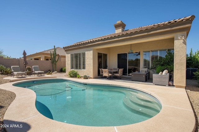 view of swimming pool featuring a patio area and ceiling fan