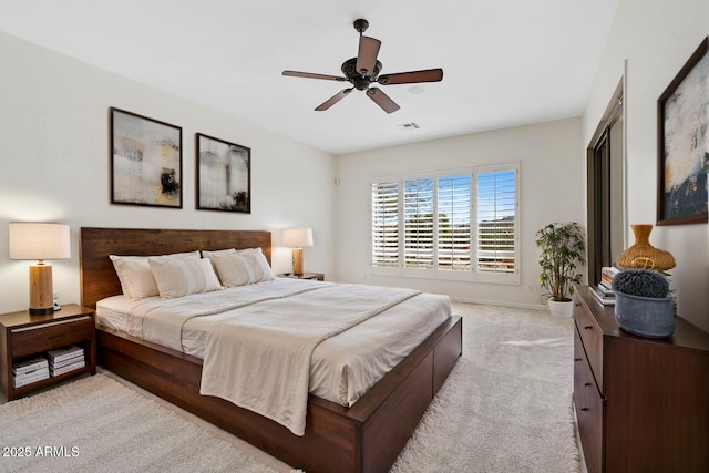 bedroom with ceiling fan, baseboards, light colored carpet, and visible vents