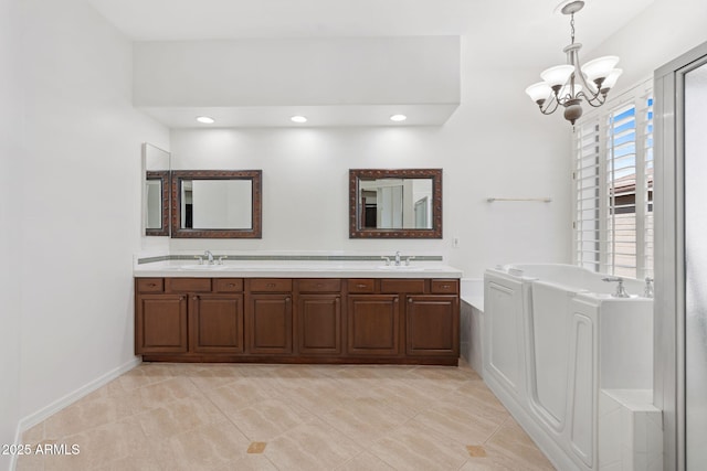 bathroom featuring tile patterned floors, a sink, a chandelier, a bath, and double vanity