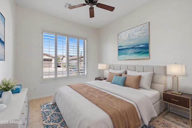 bedroom with baseboards, carpet flooring, visible vents, and a ceiling fan