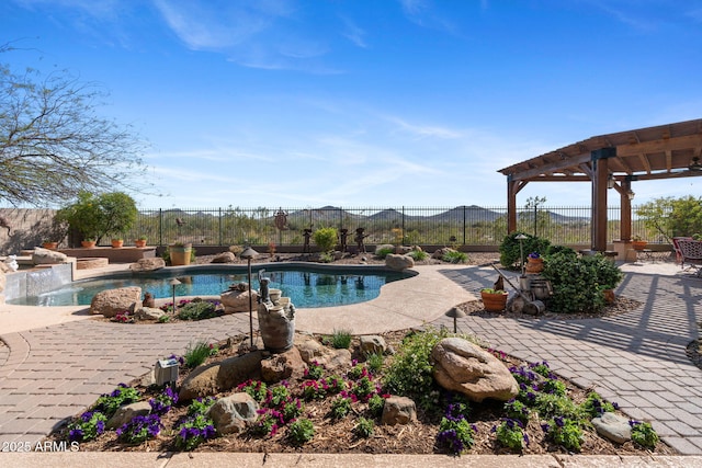 view of swimming pool featuring fence, a fenced in pool, a pergola, and a patio area