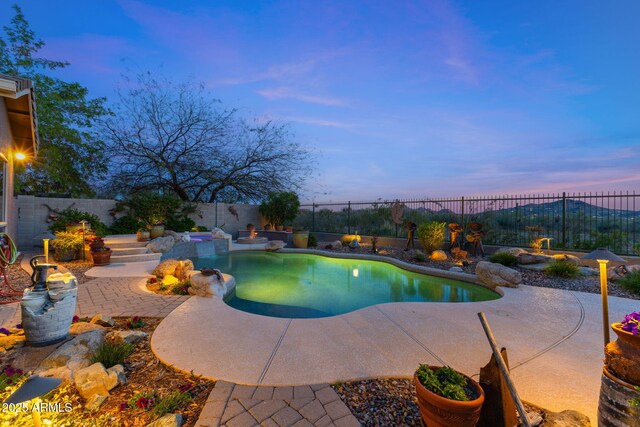 view of swimming pool featuring a fenced backyard, a patio, and a fenced in pool